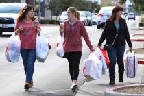 Gina Jackson, left, her daughter Haley and Angie Boschetto leave Macy's store after shopping du ...