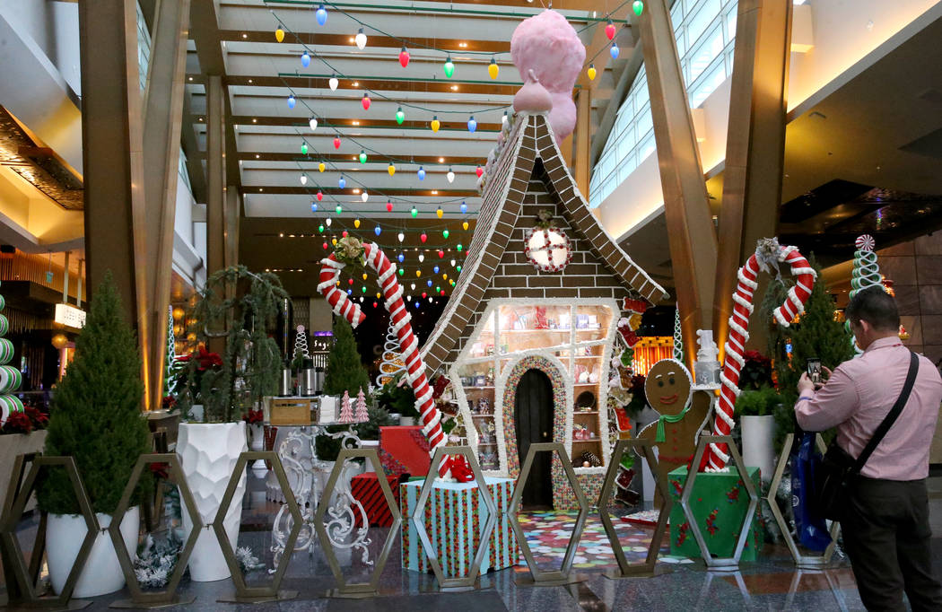 A 15-foot-tall gingerbread house in the lobby of Aria in Las Vegas Monday, Nov. 18, 2019. The t ...