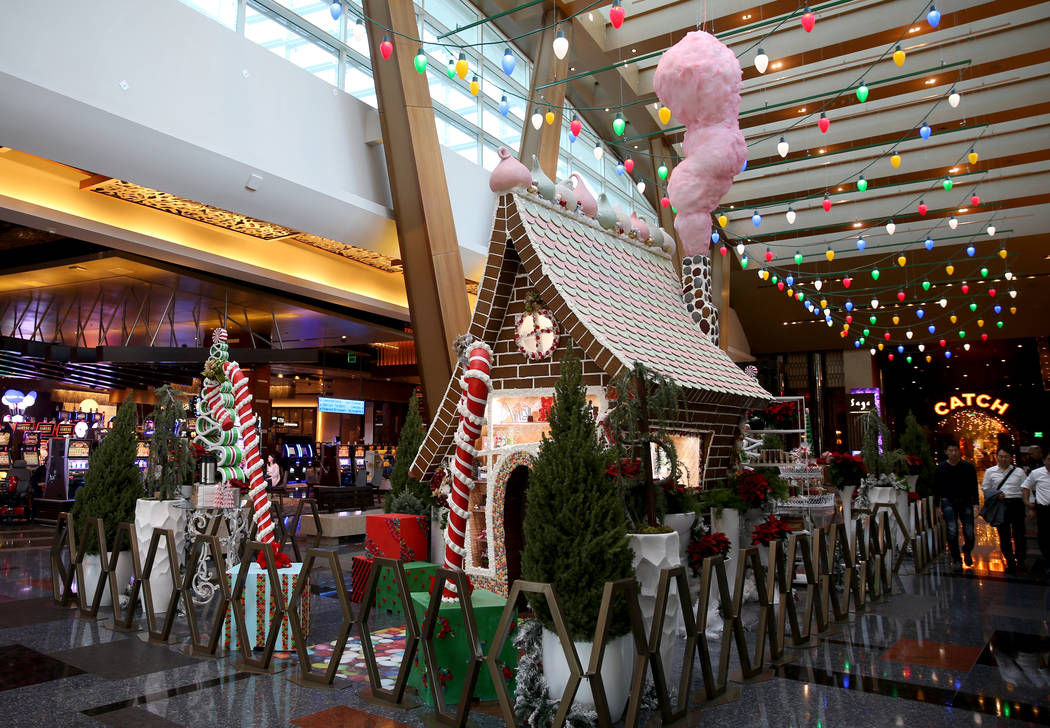 A 15-foot-tall gingerbread house in the lobby of Aria in Las Vegas Monday, Nov. 18, 2019. The t ...