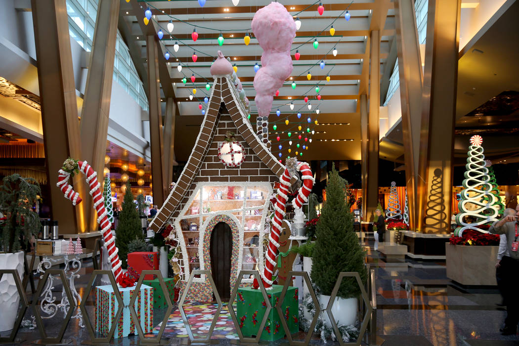 A 15-foot-tall gingerbread house in the lobby of Aria in Las Vegas Monday, Nov. 18, 2019. The t ...