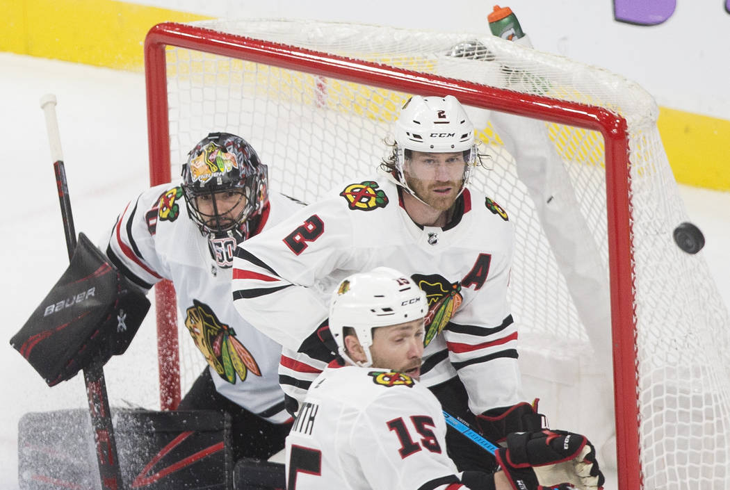 Chicago Blackhawks center Zack Smith (15), Chicago Blackhawks defenseman Duncan Keith (2) and C ...