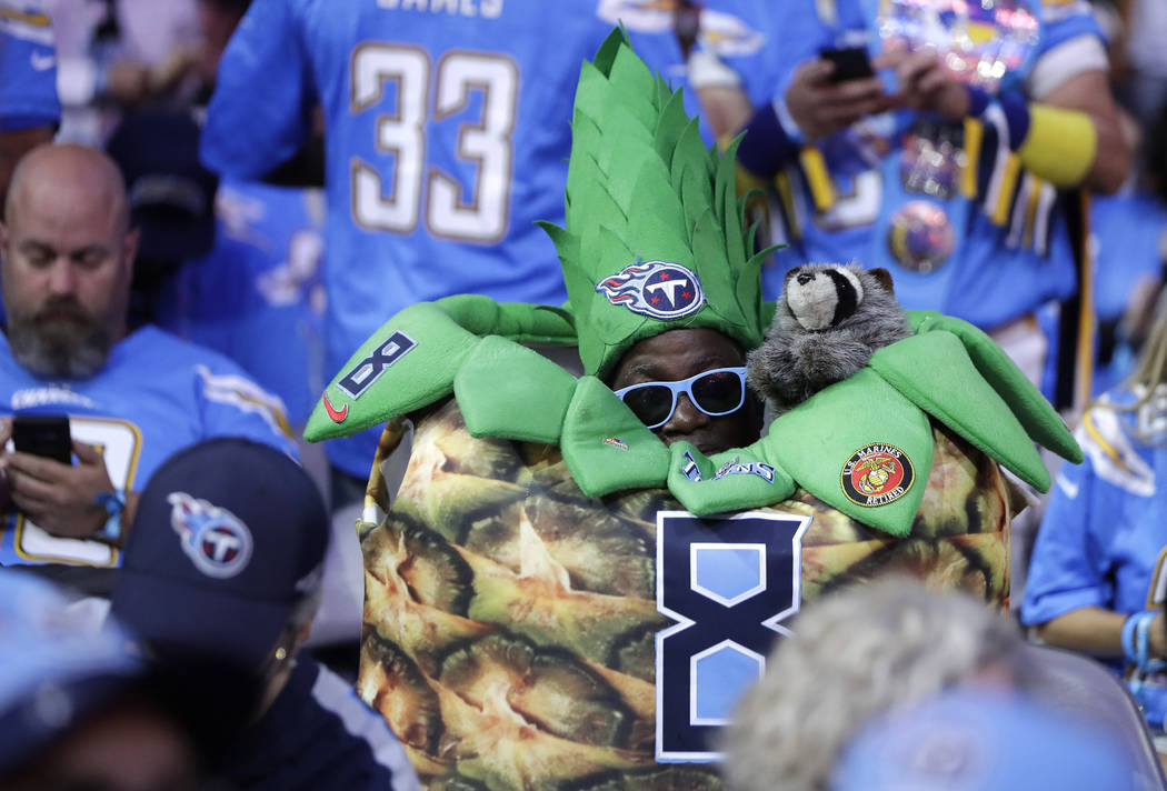 Tennessee Titans fans watch activity on the main stage during the first round at the NFL footba ...