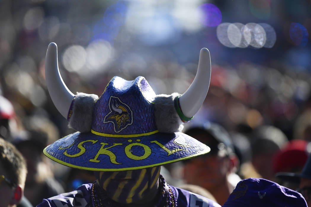 A Minnesota Vikings fan stands near the main stage ahead of the second round of the NFL footbal ...