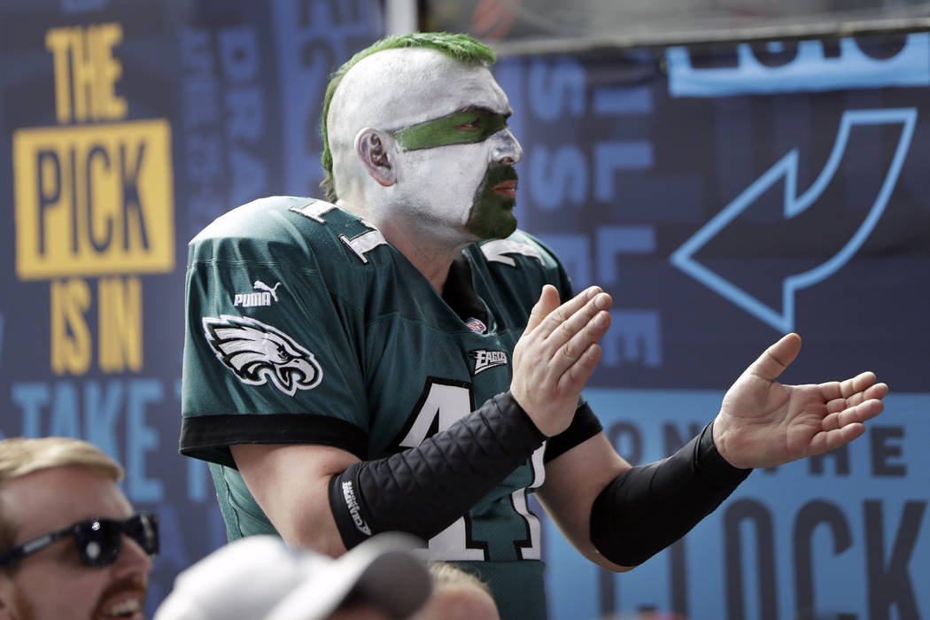 Philadelphia Eagles fan Jamie Pagliei, of Philadelphia, cheers as a draft pick is announced on ...