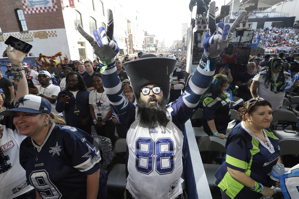 Dallas Cowboys fan Matt Franco, of of Austin, Texas, stands on the main stage ahead of the seco ...