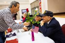 Korean War veteran Sammy Liguori, left, talks with World War II veterans Harry Galati, center, ...