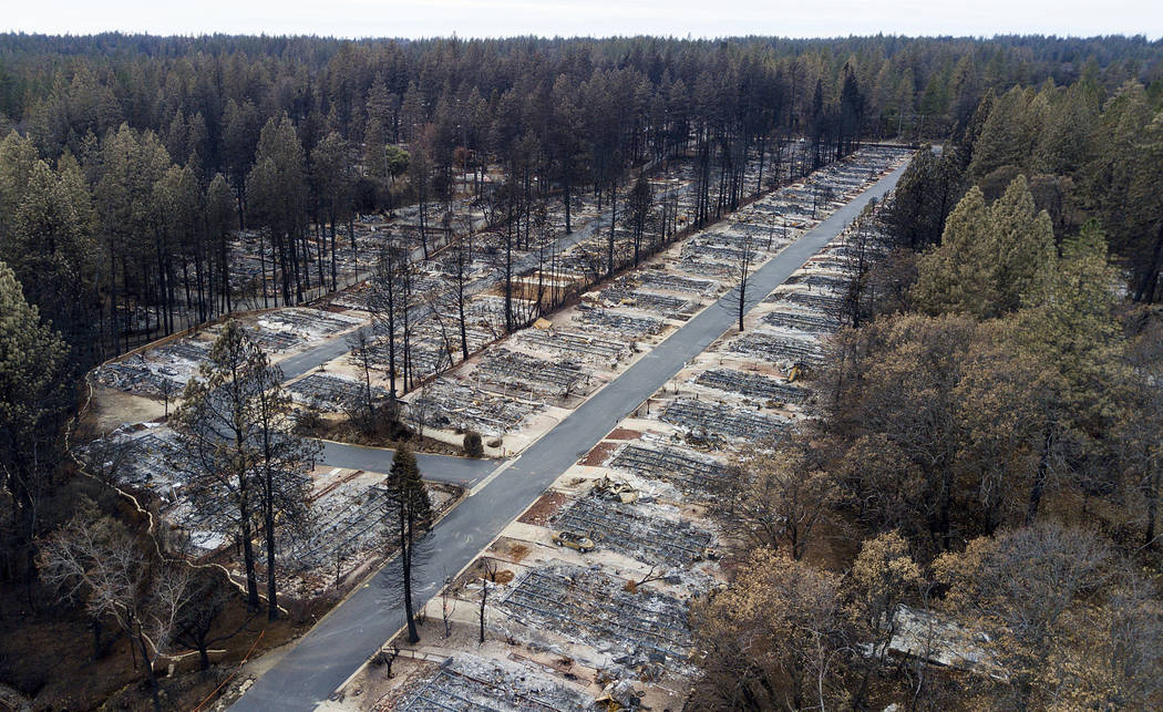 FILE - In this Dec. 3, 2018, file photo, homes leveled by the Camp Fire line the Ridgewood Mobi ...