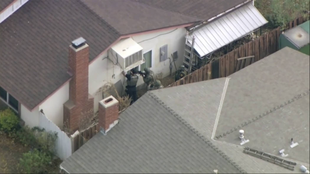 Police search a home in connection with shooting at Saugus High School on Thursday, Nov. 14, 20 ...