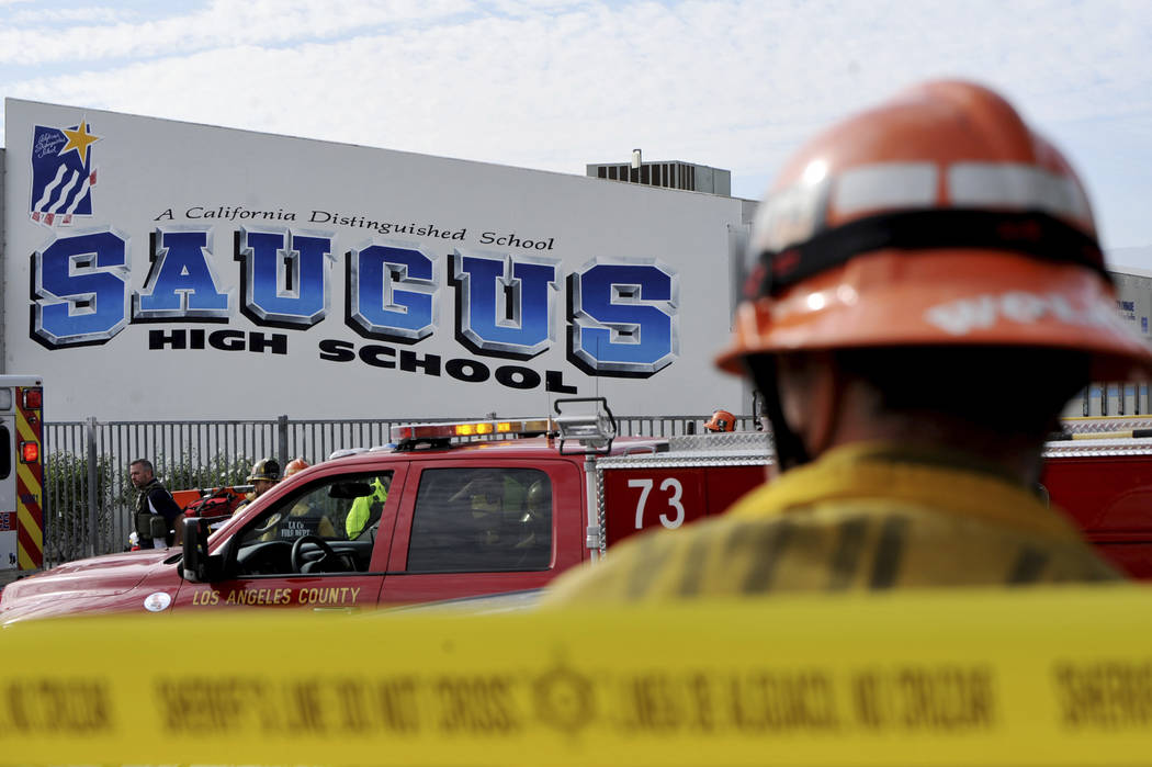 First responders standby for any injured students after a gunman opened fire at Saugus High Sch ...