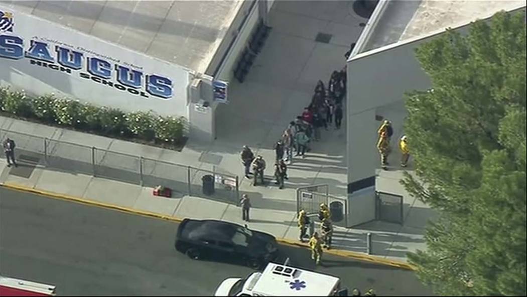 People are lead out of Saugus High School after reports of a shooting on Thursday, Nov. 14, 201 ...