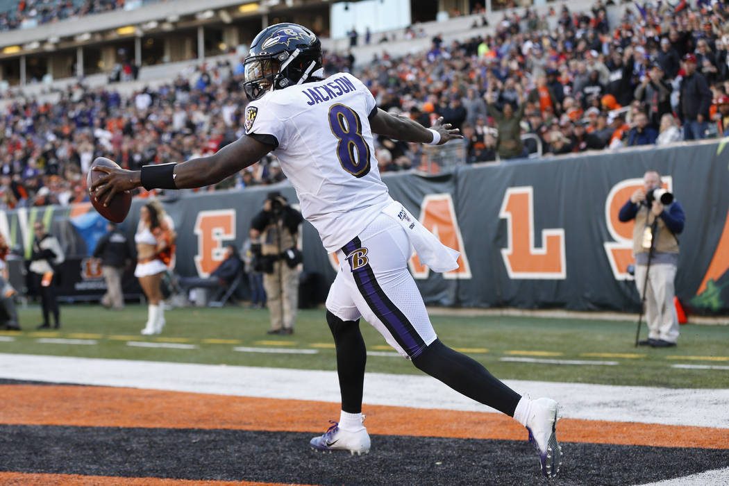 Baltimore Ravens quarterback Lamar Jackson celebrates his touchdown during the second half of N ...