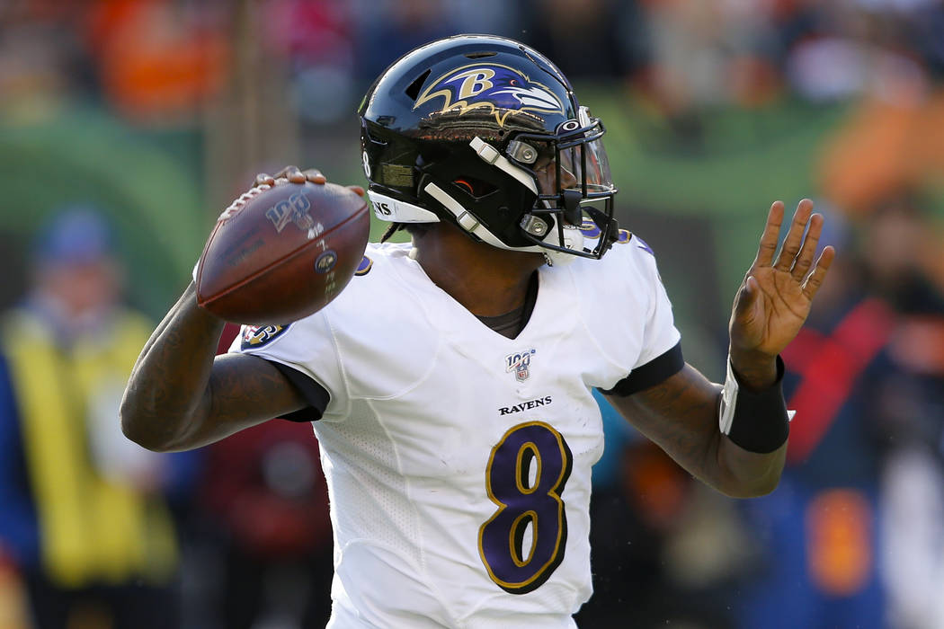 Baltimore Ravens quarterback Lamar Jackson passes during the second half of NFL football game a ...