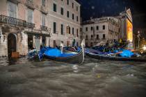 Stranded gondolas float adrift over the flooded banks, in Venice, Wednesday, Nov. 13, 2019. The ...
