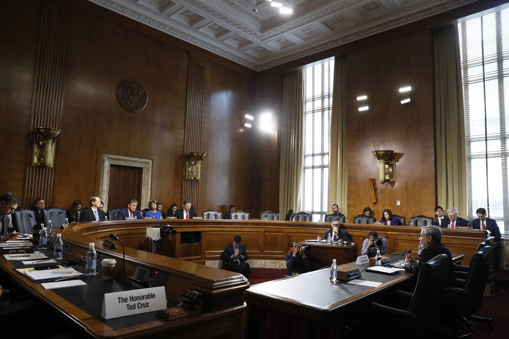 Secretary of Energy nominee Dan Brouillette, right, testifies during a Senate hearing on his no ...
