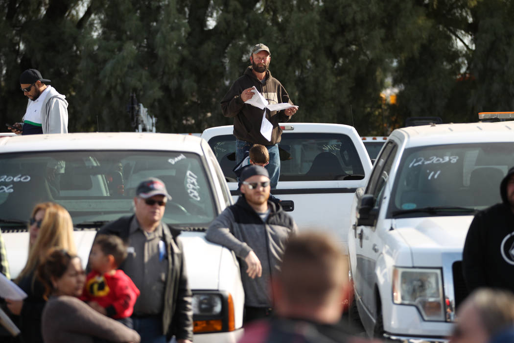 People attend Clark County's fall government auction at the TNT Auction lot in Las Vegas, Satur ...