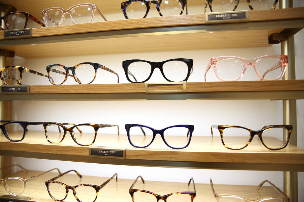 Glasses on display at the new Warby Parker store in Downtown Summerlin in Las Vegas, Thursday, ...