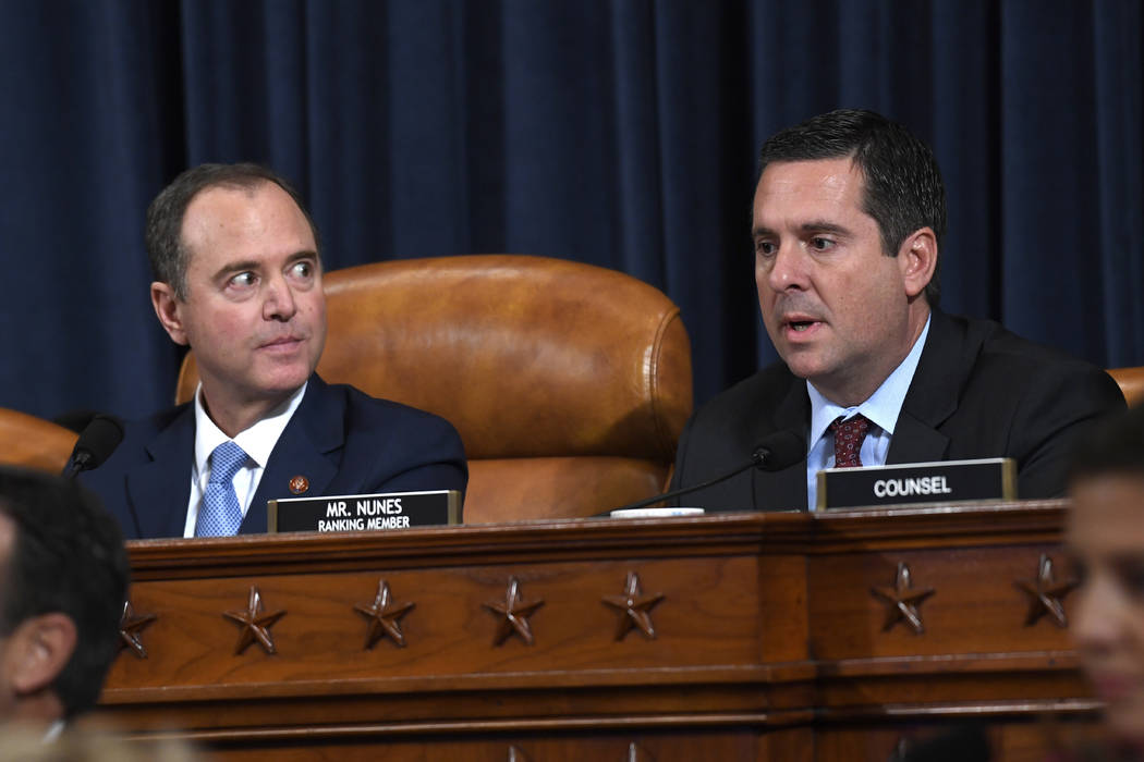 Chairman of the House Intelligence Committee Adam Schiff, D-Calif., left, listens as tracking m ...