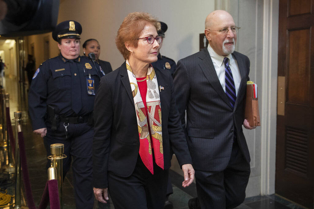 Former U.S. Ambassador to Ukraine Marie Yovanovitch walks to the hearing room to testify to the ...