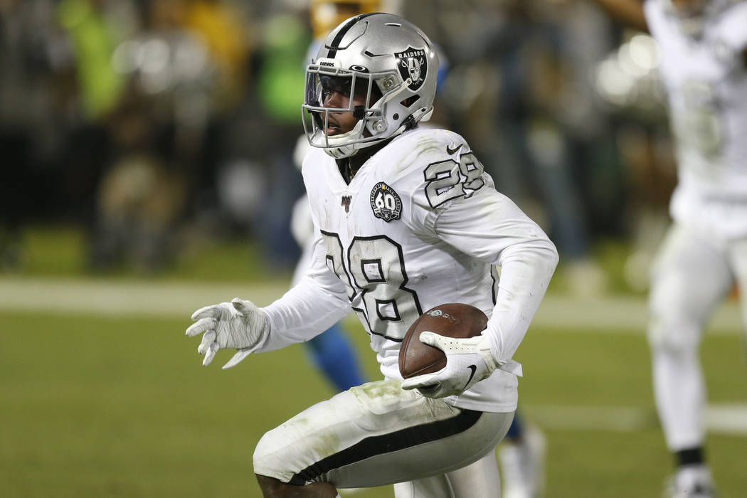 Oakland Raiders running back Josh Jacobs (28) runs toward the end zone to score against the Los ...