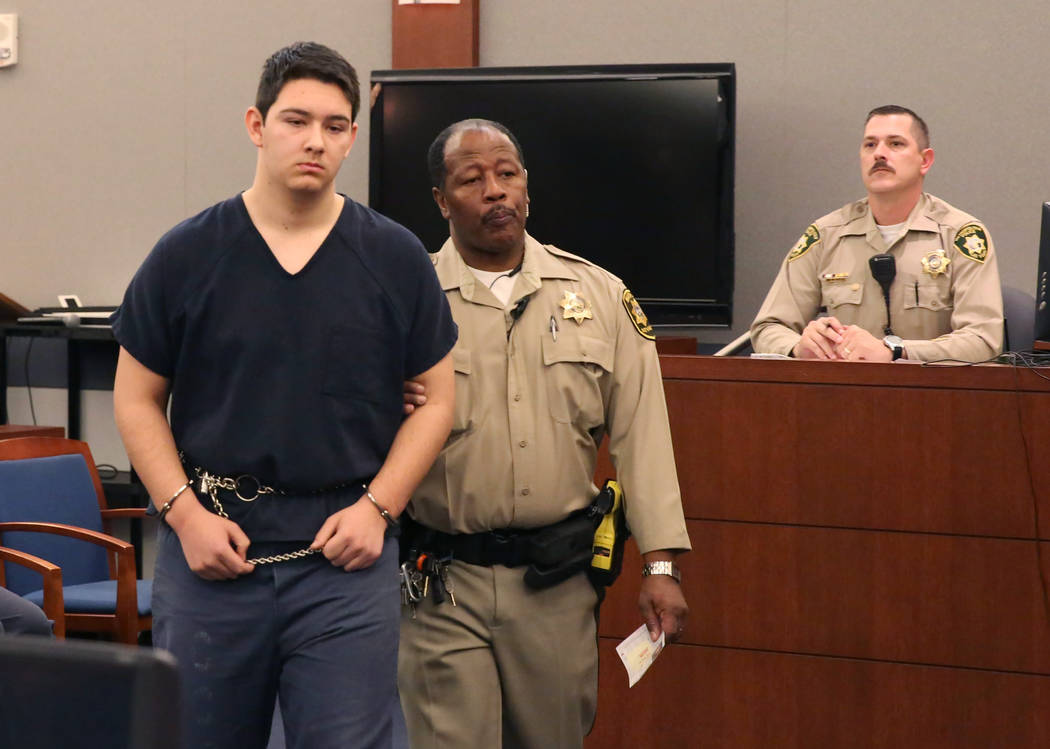 Maysen Melton, a 16-year-old accused of raping classmates, lead out of the courtroom after his ...