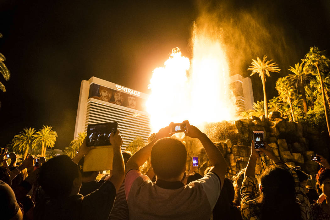 A large crowd gathers to watch the volcano at The Mirage on the Strip on Tuesday, Oct. 11, 2016 ...
