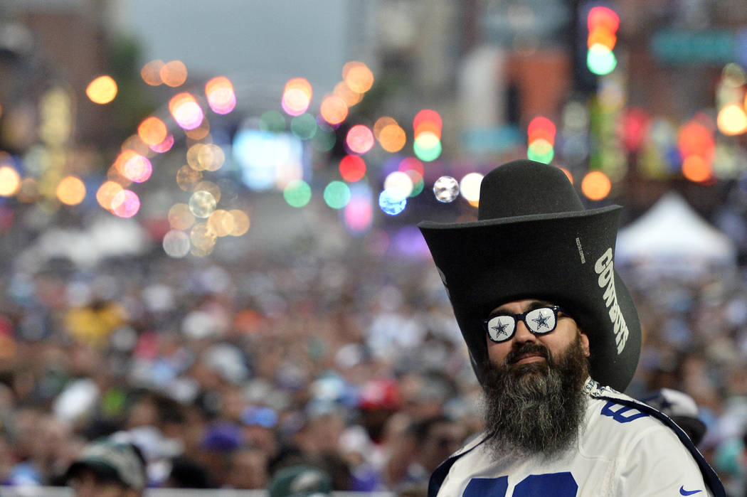 A Dallas Cowboys fan stands during the 2019 NFL Draft Thursday, Apr. 25, 2019, in Nashville, Te ...