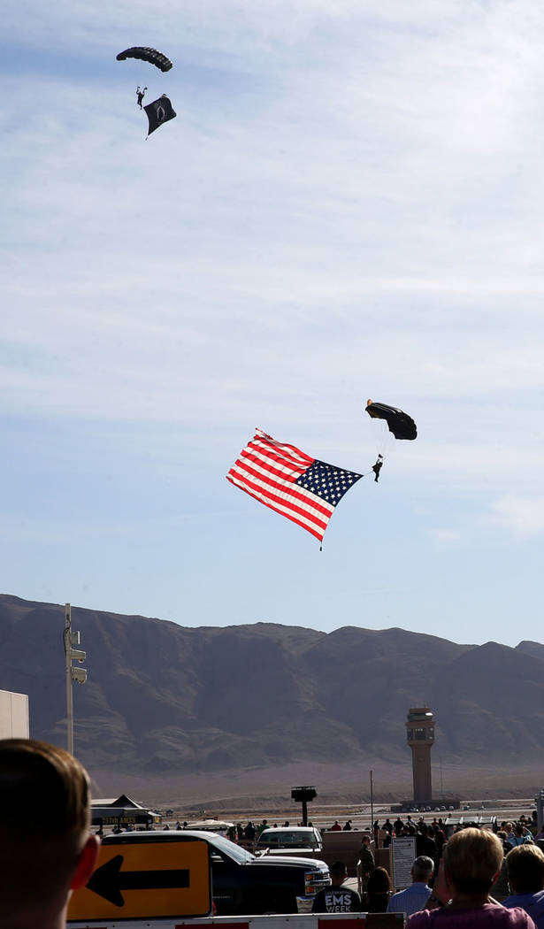Airmen and guests stand for the American flag at Aviation Nation 2019 Air Show preview at Nelli ...