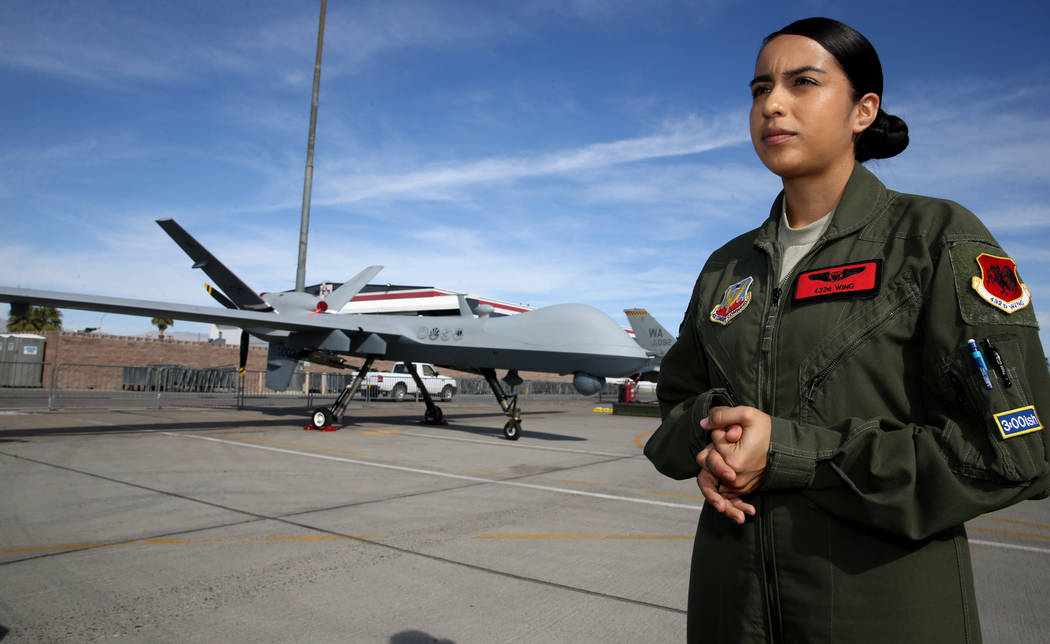 Sensor Operator Airman 1st Class Jackie with an MQ9 remotely piloted aircraft she helps fly at ...
