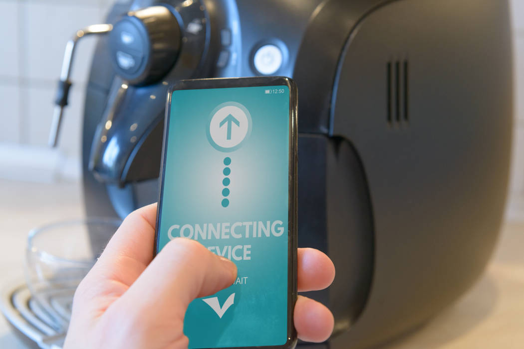 Homeowners can program their coffee machines from their smartphones. (Getty Images)