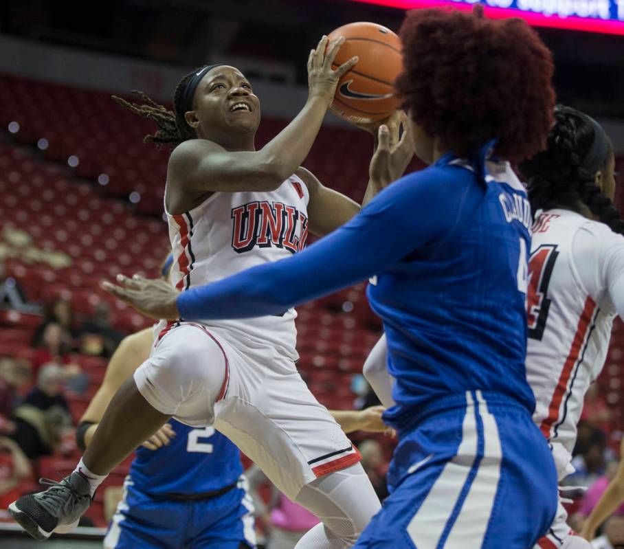 UNLV Lady Rebels guard LaTecia Smith (0) slices to the basket past Duke Blue Devils forward Jad ...