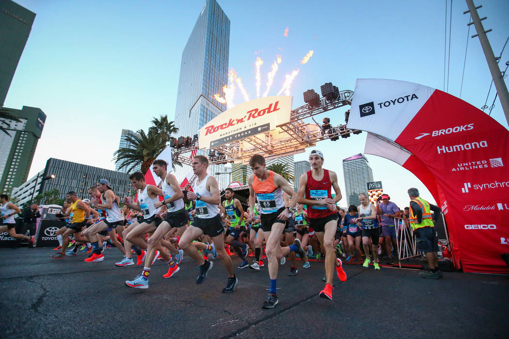 Runners take off from the starting line during the 2018 Rock 'n' Roll Marathon on the Strip in ...