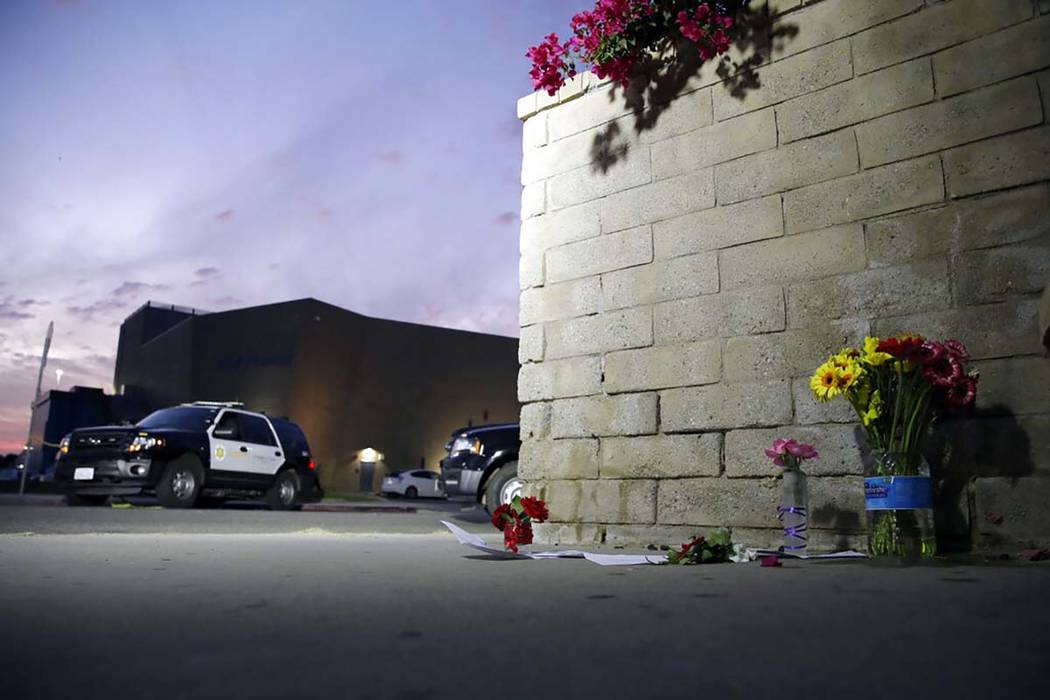 Flowers are placed in front of Saugus High School in the aftermath of a shooting on Thursday, N ...
