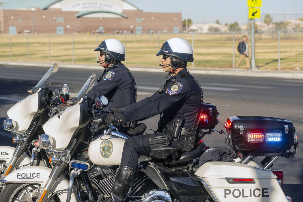 Officers Shane Burton, left, and Chris Lourenco, both from "Fab Five," the five-membe ...