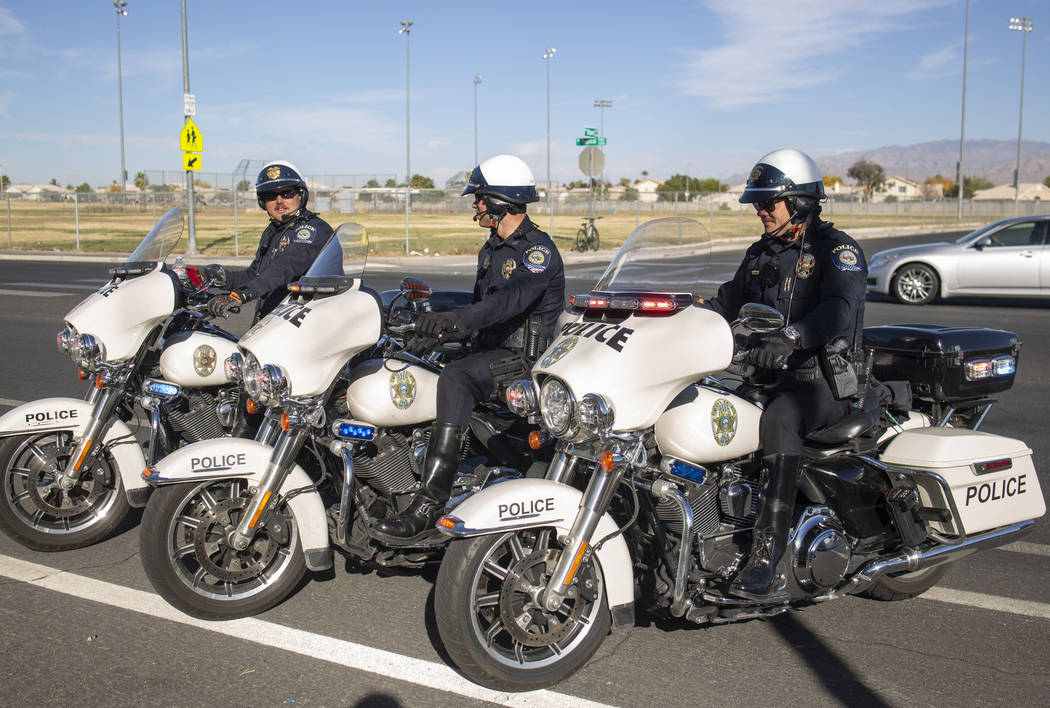 Officers Shane Burton, left, and Chris Lourenco, center, and Chris Deuel, from "Fab Five, ...