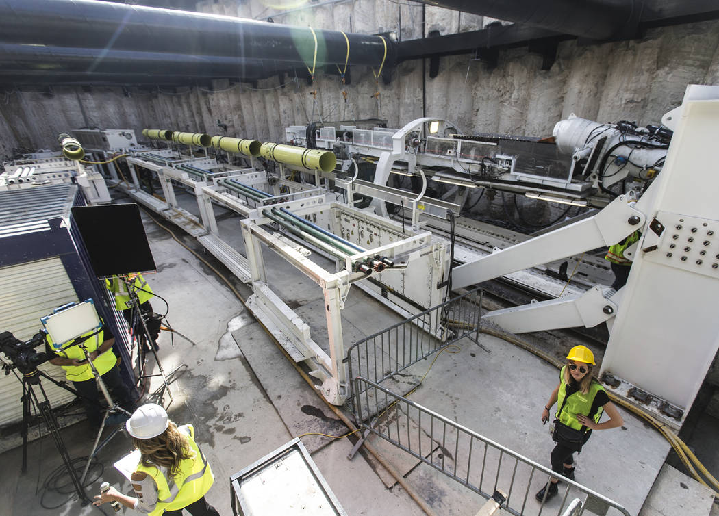 Media get a first glimpse at a tunnel boring machine at the future location of an underground p ...