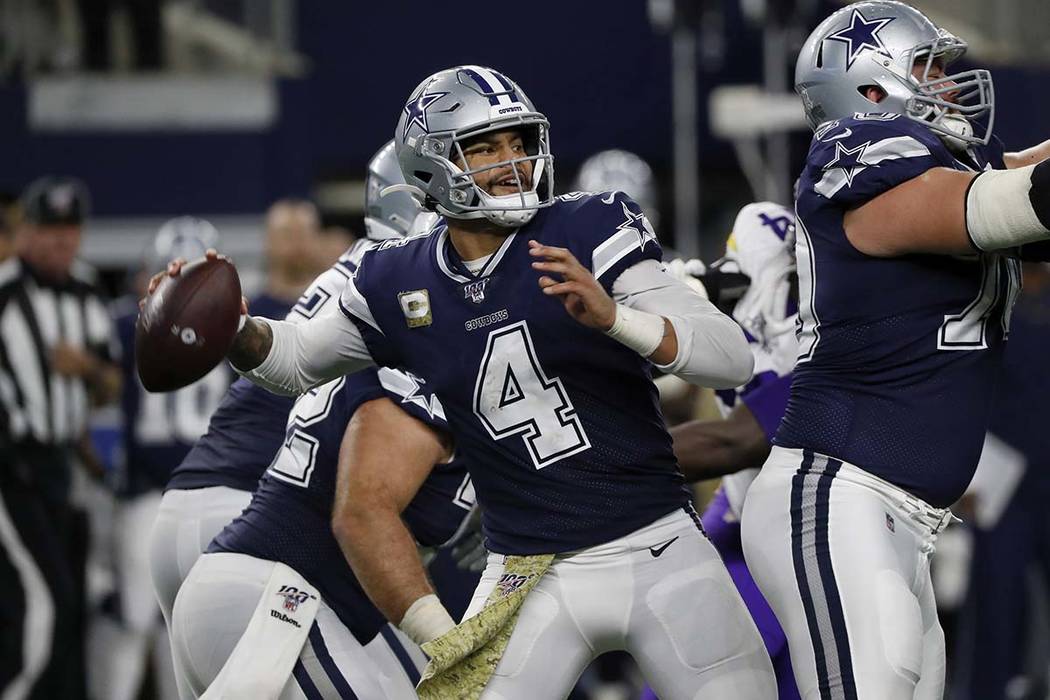 Dallas Cowboys quarterback Dak Prescott throws the ball during the second half of an NFL footba ...