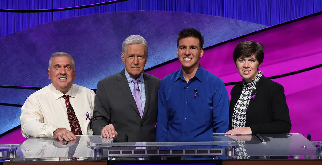 From left, Francois Barcomb of New York, “Jeopardy!” host Alex Trebek, James Holzhauer of L ...