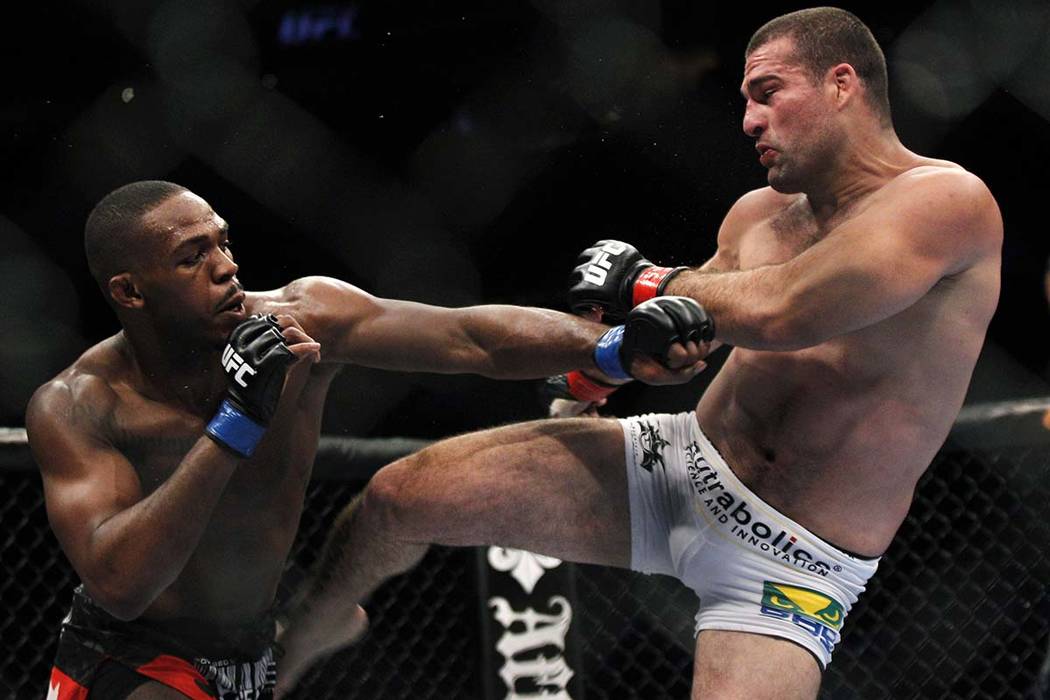 Mauricio Rua, right, kicks Jon Jones during their mixed martial arts match at UFC 128 Saturday ...