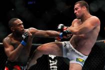 Mauricio Rua, right, kicks Jon Jones during their mixed martial arts match at UFC 128 Saturday ...