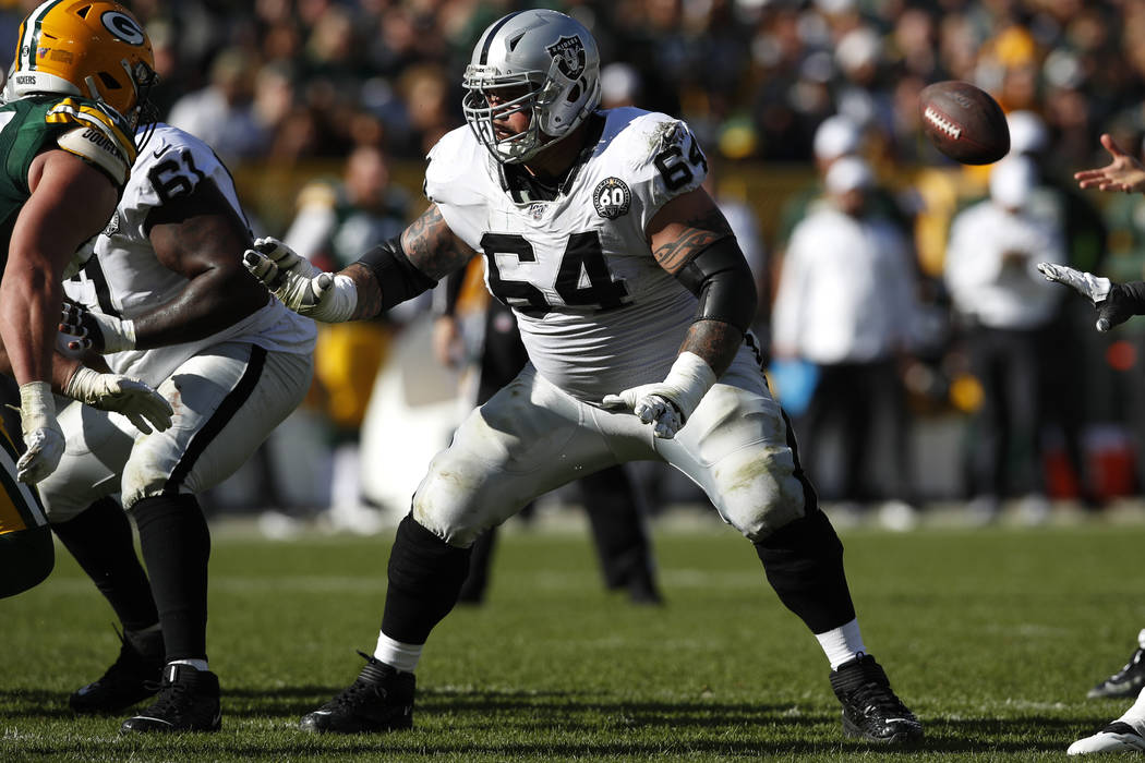 Oakland Raiders center Richie Incognito (64) sets to block against the Green Bay Packers during ...