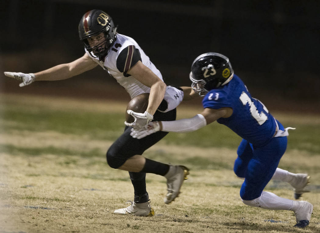 Faith Lutheran senior wide receiver Peyton Thornton (14) turns up field past Desert Pines senio ...