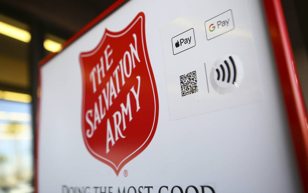 Signage for The Salvation Army featuring a QR code that allows users to donate with their mobil ...