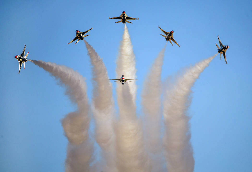 All six U.S. Air Force Thunderbirds break away from formation in various directions during the ...