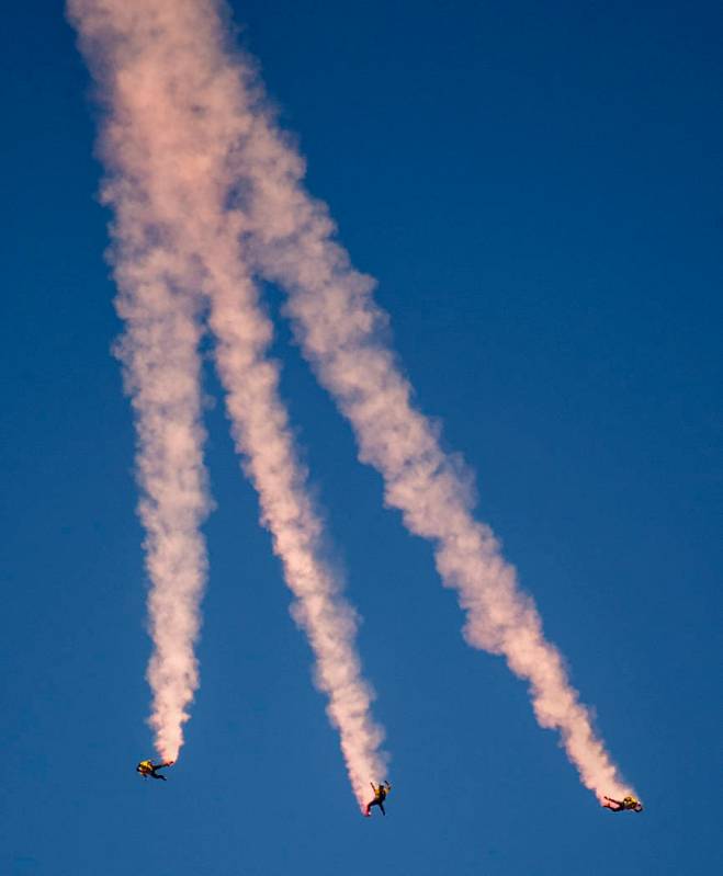 Special Operations Command Para-Commandos streak downward before deploying their parachutes dur ...