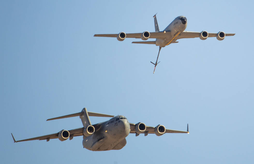 A C-17 Globemaster III, bottom left, and KC-135 Stratotanker fly together during the Aviation N ...