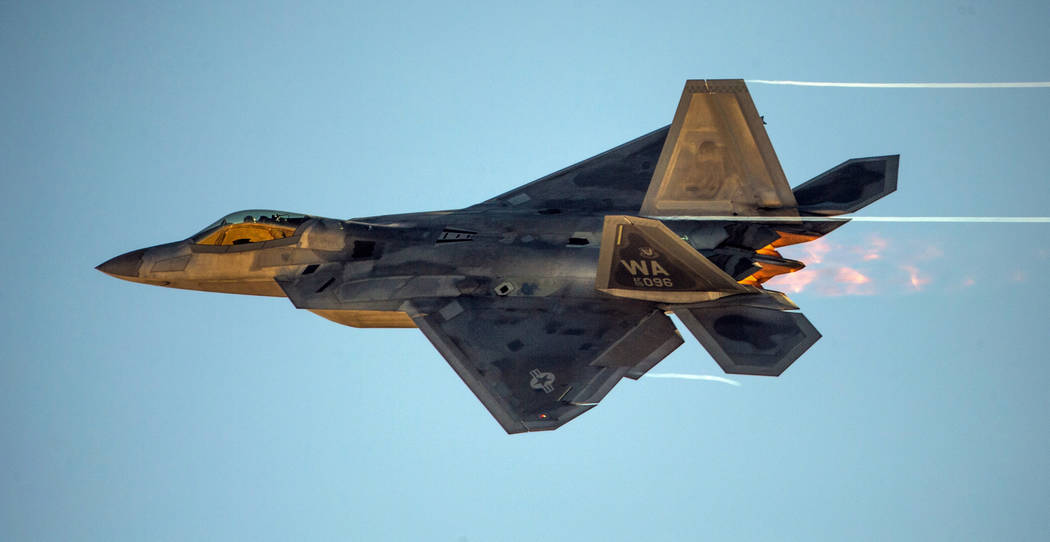 An F-22 Raptor streaks across the sky during the Aviation Nation at Nellis Air Force Base on Sa ...