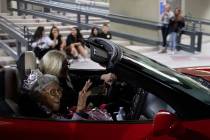 Audrey James, 105, rides through the UNLV homecoming parade as honorary homecoming queen on Fri ...