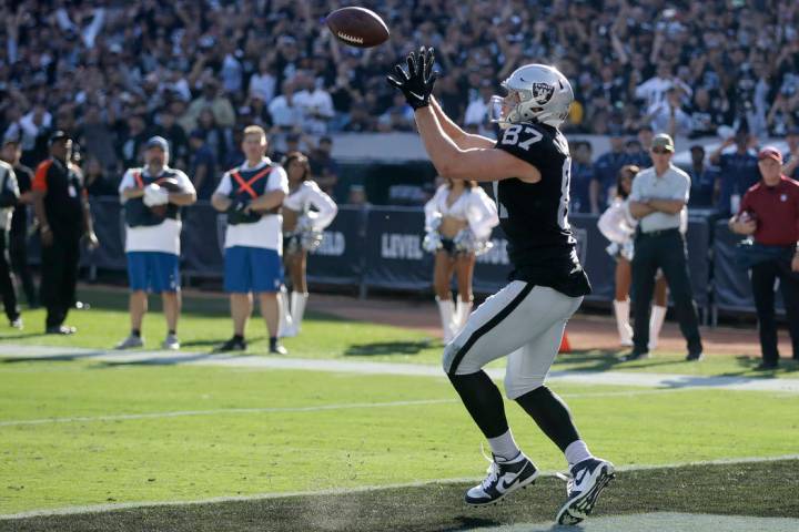 Oakland Raiders tight end Foster Moreau catches the ball for a touchdown during the first half ...