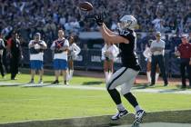 Oakland Raiders tight end Foster Moreau catches the ball for a touchdown during the first half ...