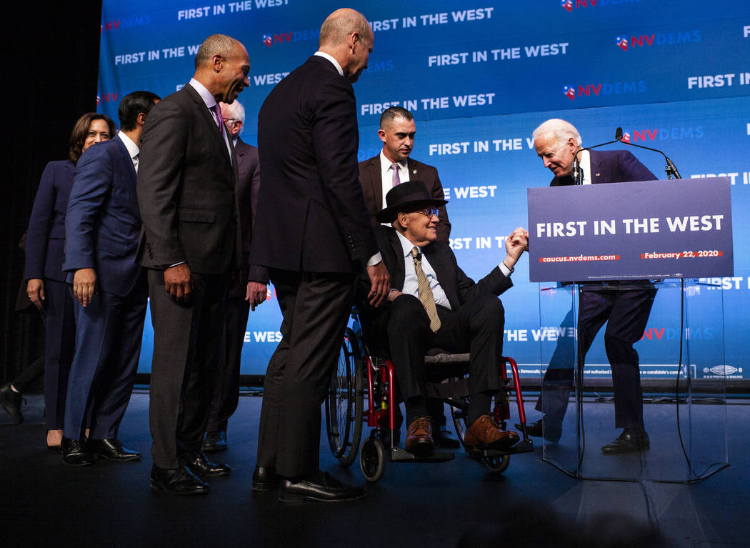 Democratic presidential candidate former Vice President Joe Biden, right, greets U.S. Sen. Harr ...